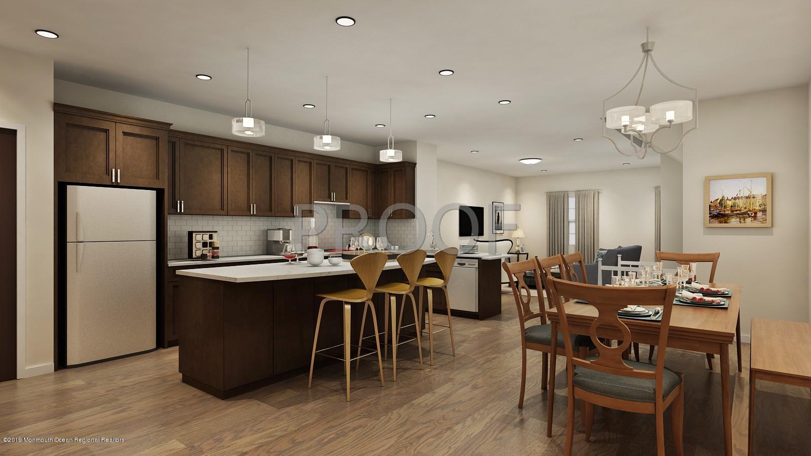 308 Discovery Road Brick, NJ 08723 - Photo 11 of 13 a large kitchen with cabinets chairs and refrigerator