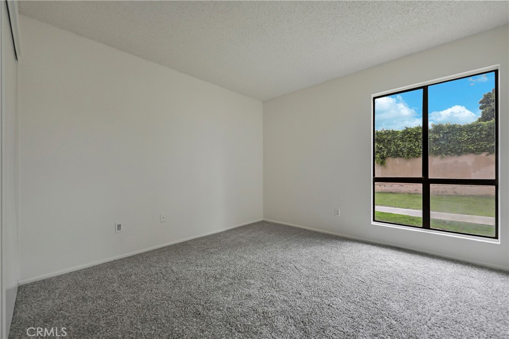 45546 Aladdin Street, Unit B101 Indio, CA 92201 - Photo 12 of 18 an empty room with a window