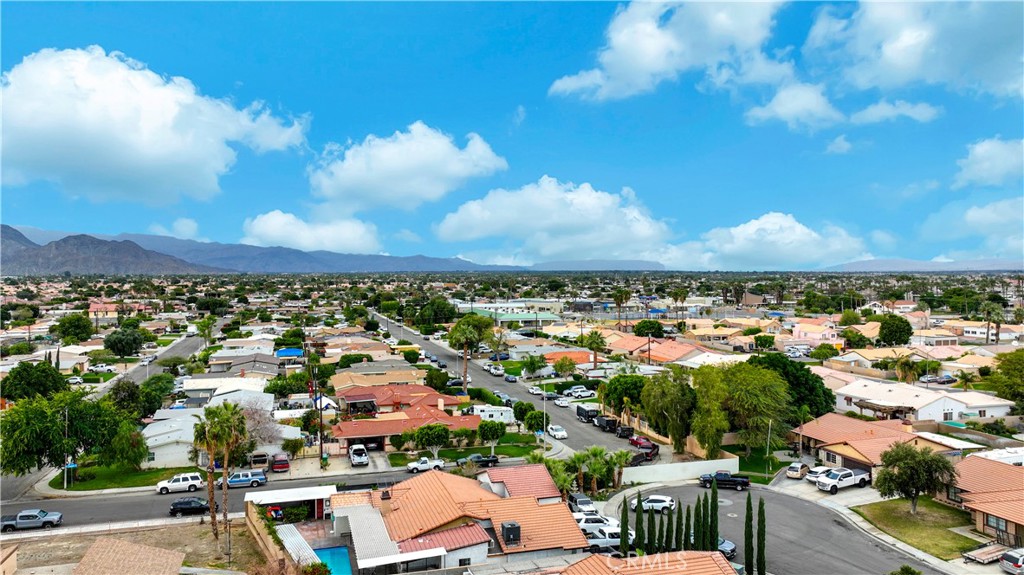 45546 Aladdin Street, Unit B101 Indio, CA 92201 - Photo 17 of 18 an aerial view of a city