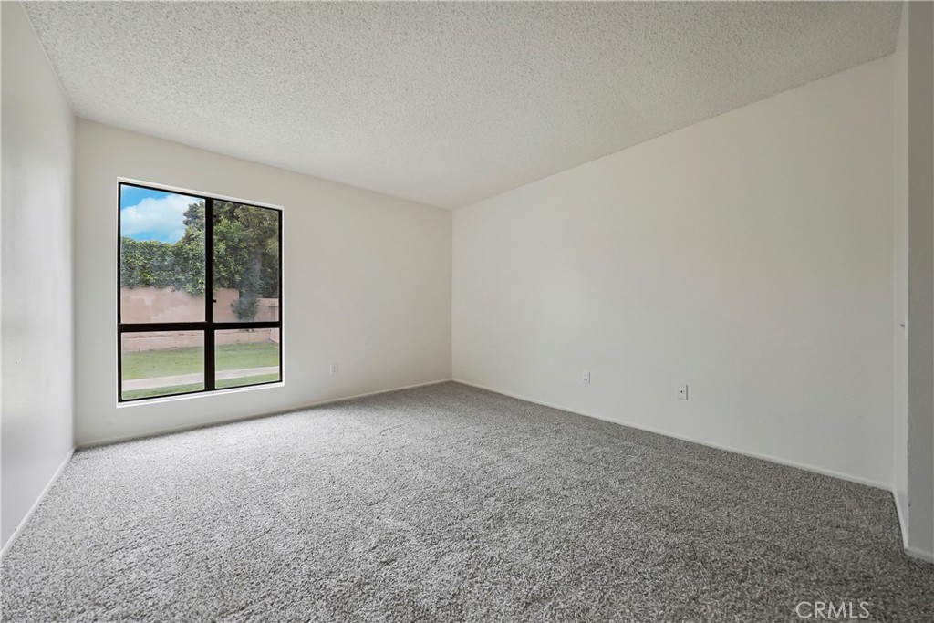 45546 Aladdin Street, Unit B101 Indio, CA 92201 - Photo 9 of 18 an empty room with a window