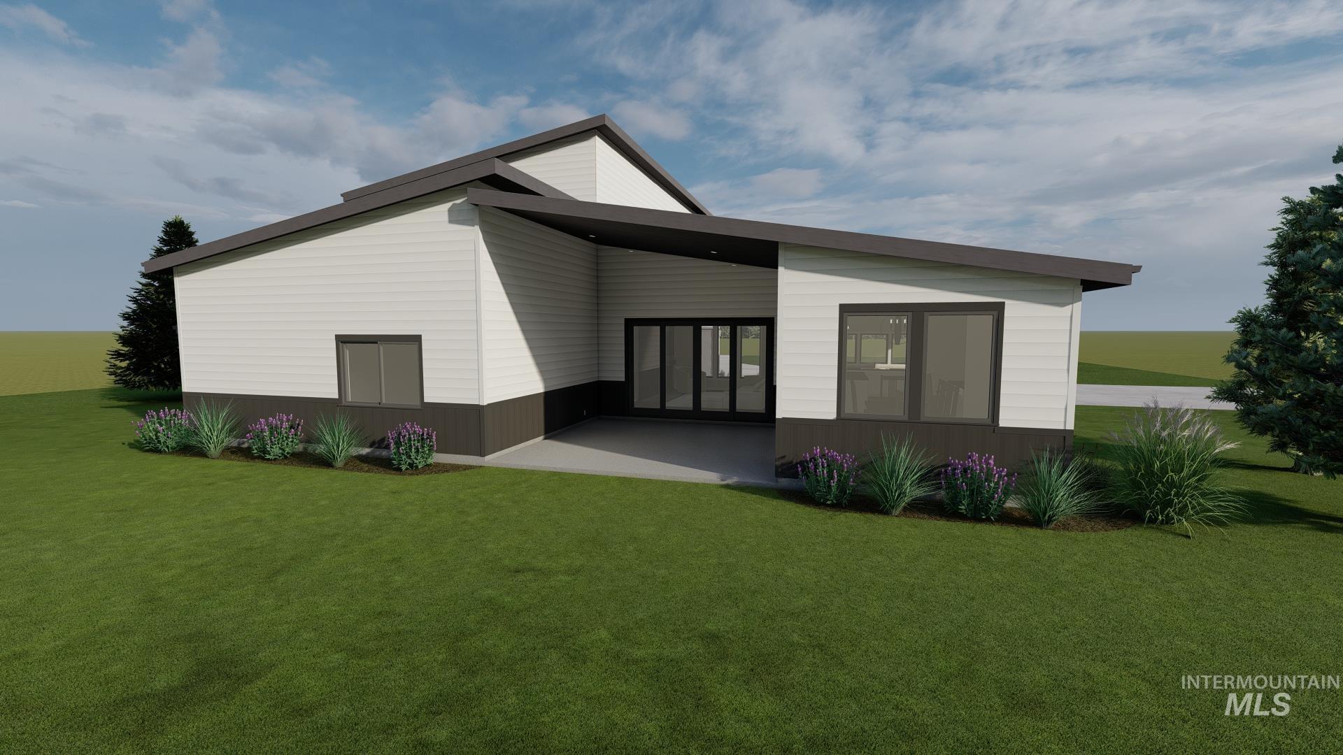1883 Grand View Road Donnelly, ID 83615 - Photo 2 of 7 Back of house with covered patio area