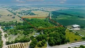 a view of a lake with a yard