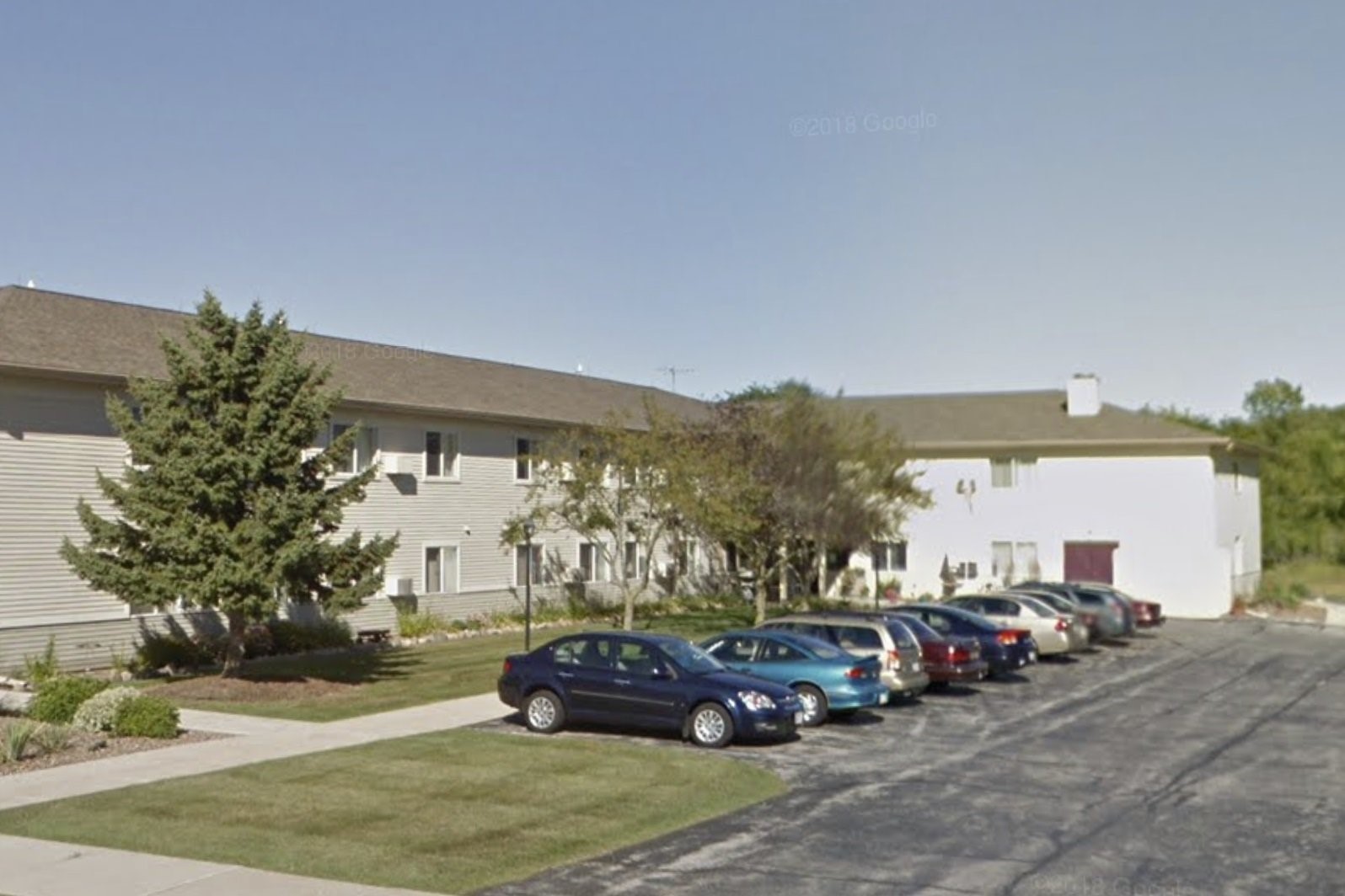 1485 North 7th Street Manitowoc, WI 54220 - Photo 3 of 11 a cars parked in front of a house