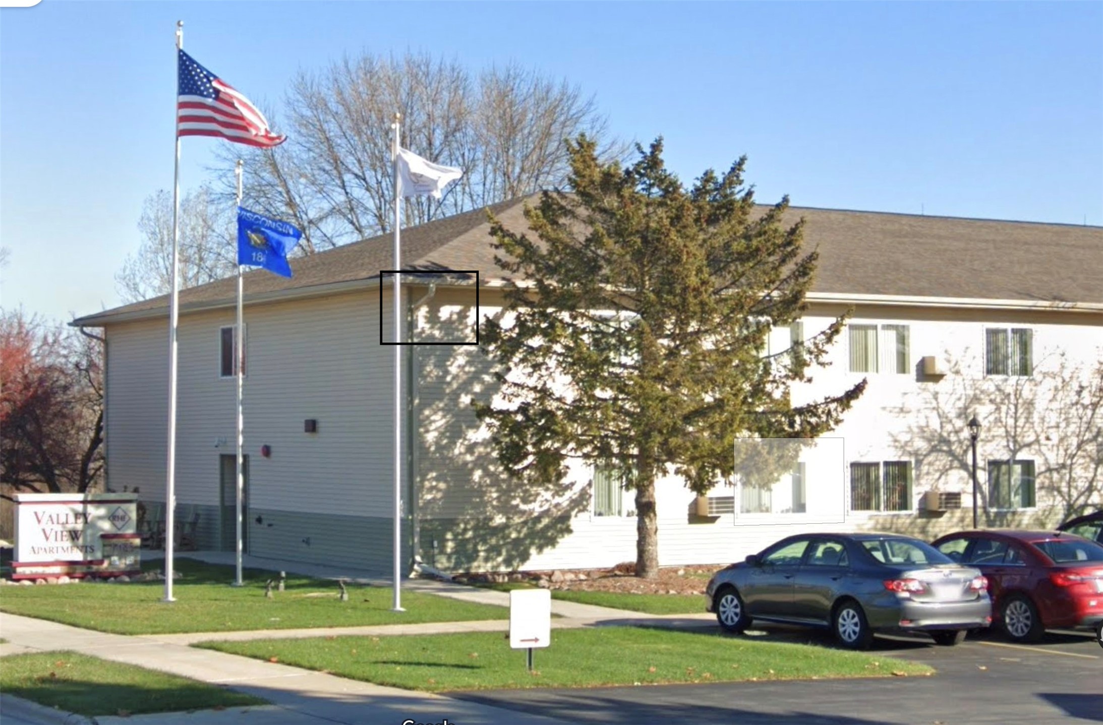 1485 North 7th Street Manitowoc, WI 54220 - Photo 4 of 11 a view of a parked cars in front of a building