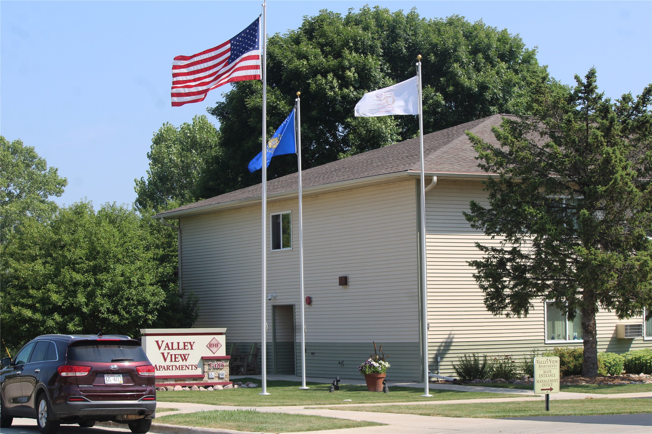 1485 North 7th Street Manitowoc, WI 54220 - Photo 8 of 11 a front view of a building with trees