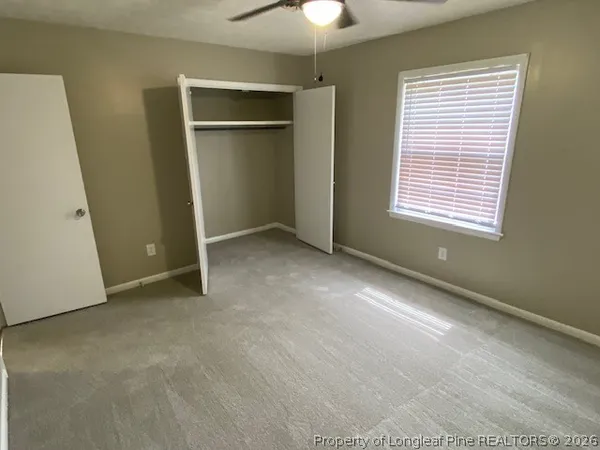 an empty room with a empty space and windows