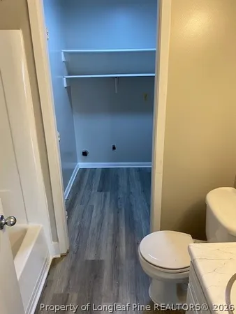a bathroom with a toilet and a sink