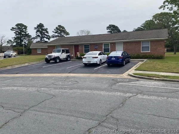 a view of a car parked in front of a house