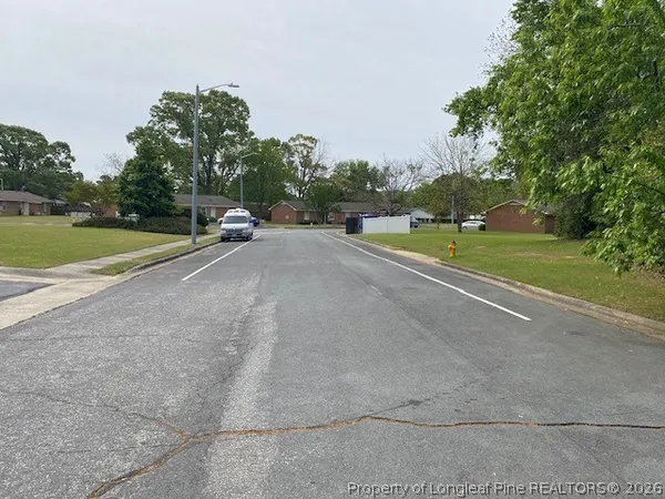 a road view with a big yard