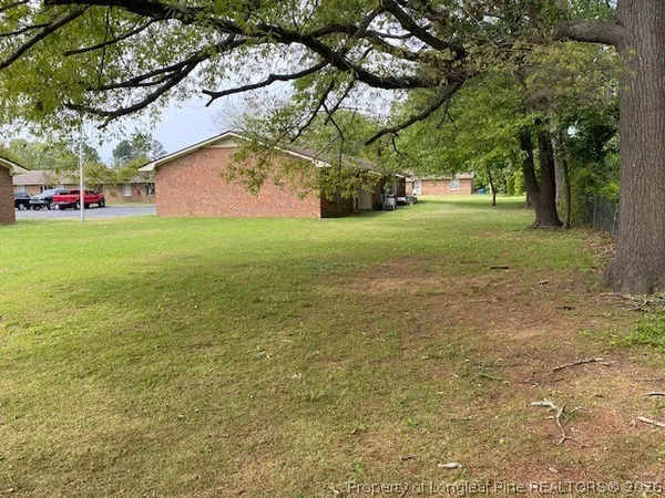 a view of a trees in front of a house