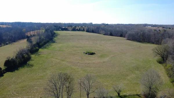 a view of a backyard of the house