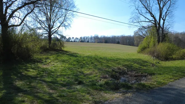 a view of a lake with a yard