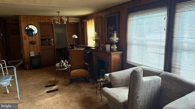 a living room with furniture rug and window