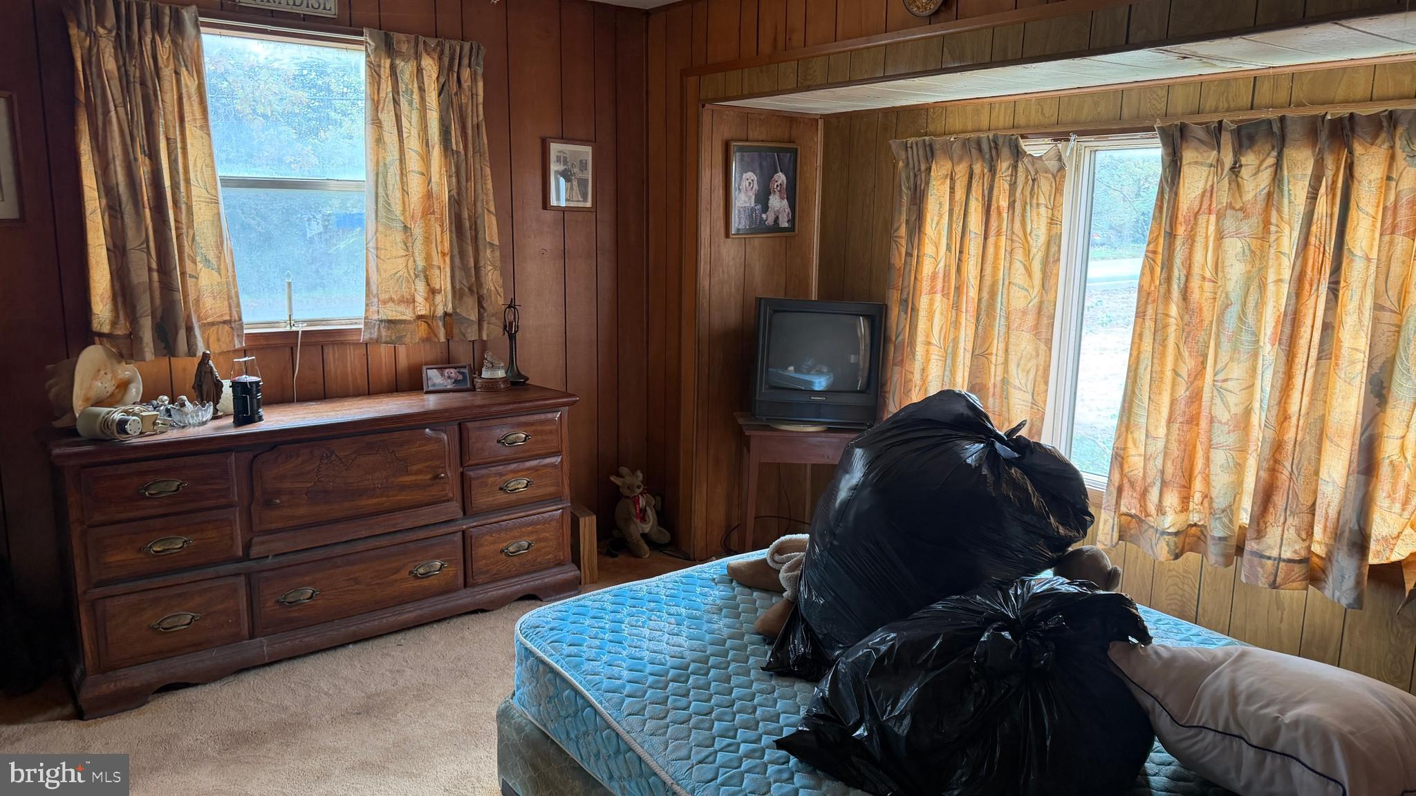 537 Dandelion Road Millville, NJ 08332 - Photo 15 of 33 a living room with a large window and dresser