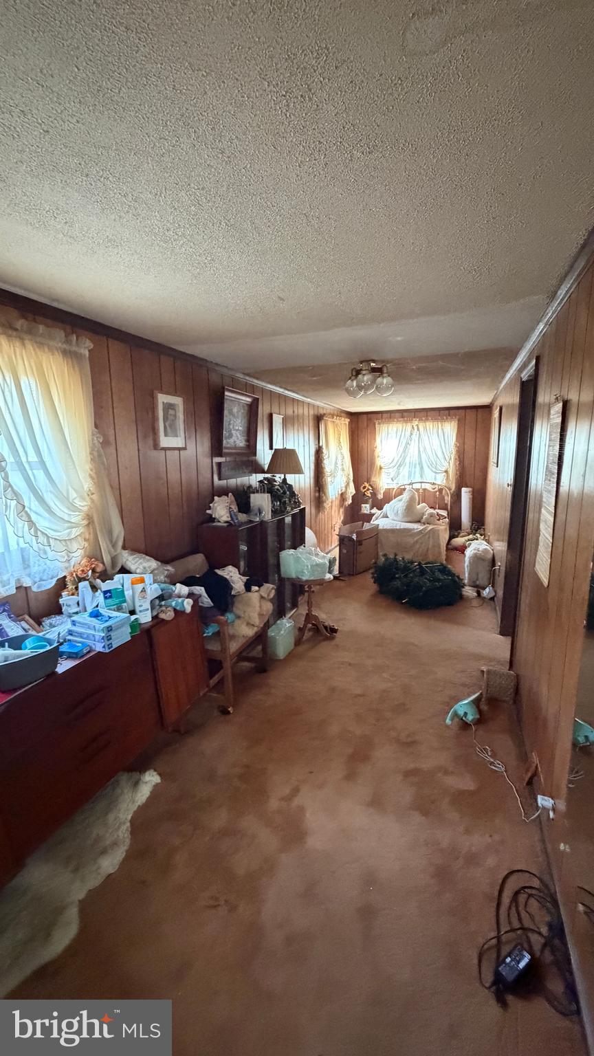537 Dandelion Road Millville, NJ 08332 - Photo 19 of 33 a living room with furniture a window and gym equipment