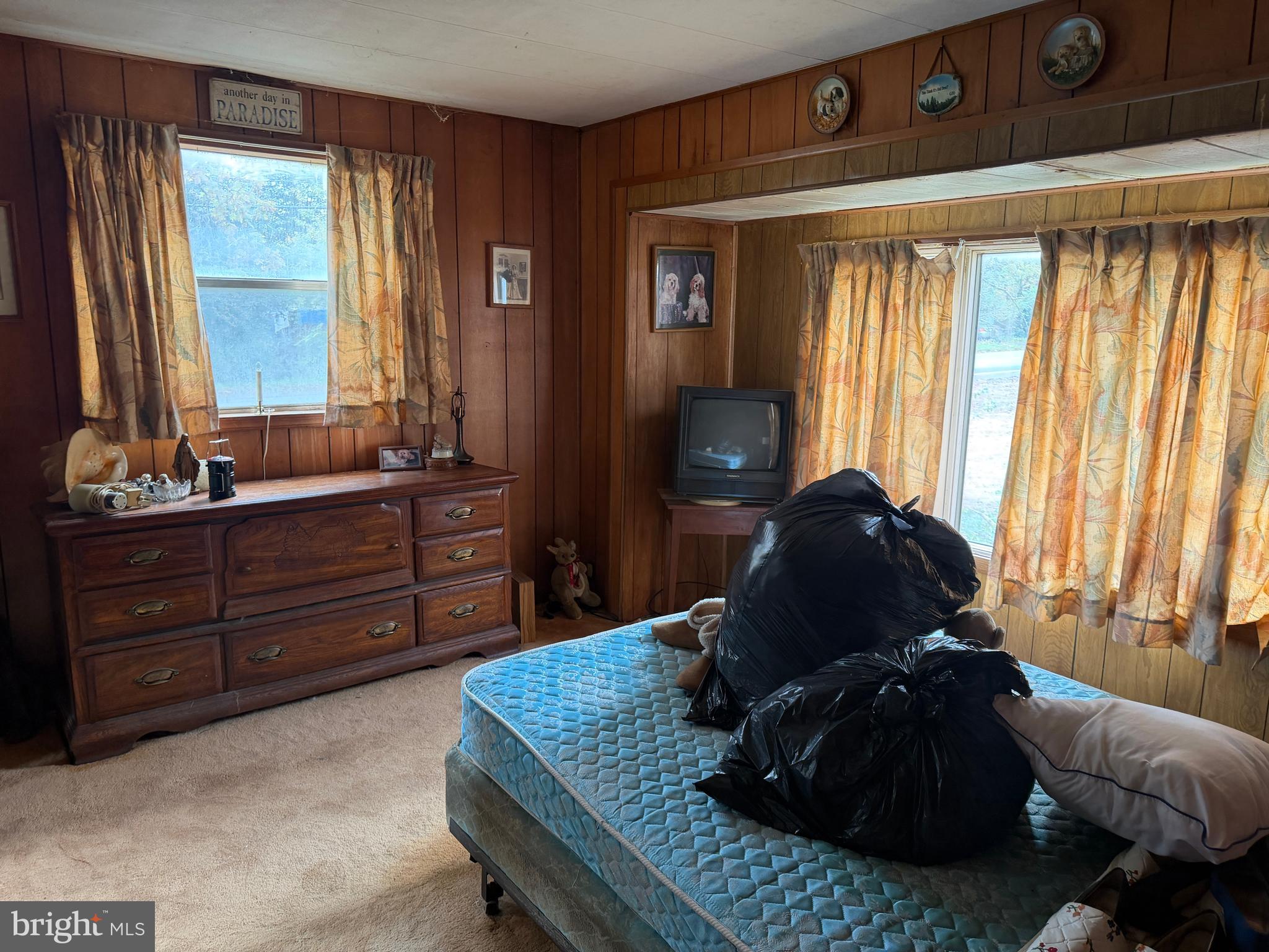 537 Dandelion Road Millville, NJ 08332 - Photo 31 of 33 a living room with a bed and a dresser