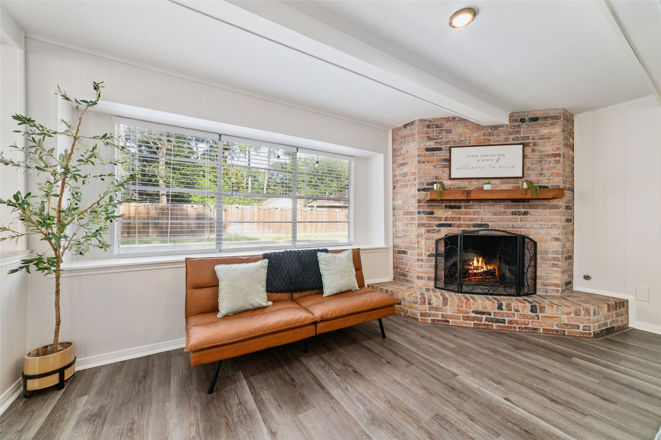 563 Landfall Lane Conroe, TX 77302 - Photo 13 of 25 a living room with furniture and a fireplace