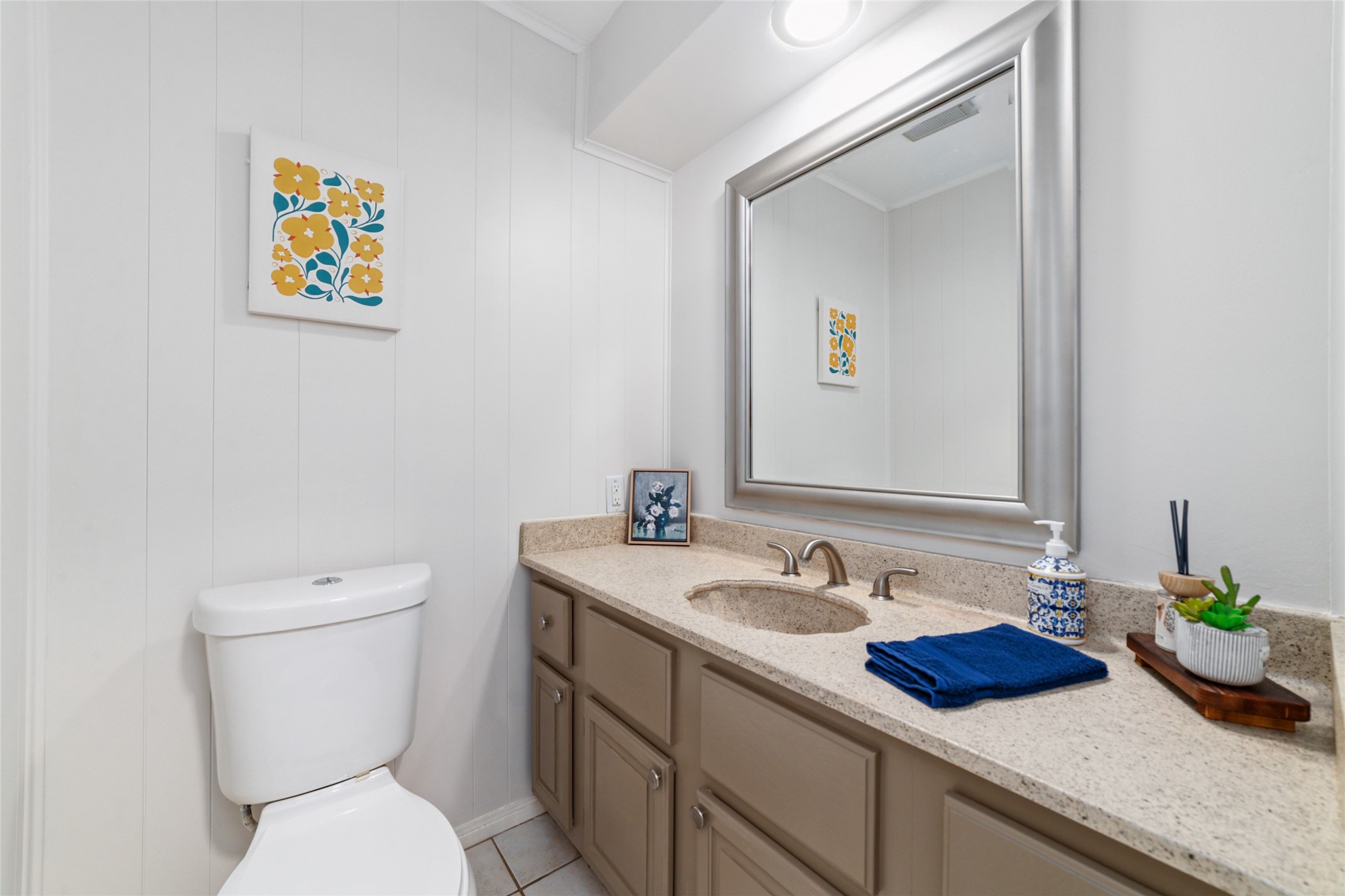 563 Landfall Lane Conroe, TX 77302 - Photo 15 of 25 a bathroom with a toilet a sink and mirror