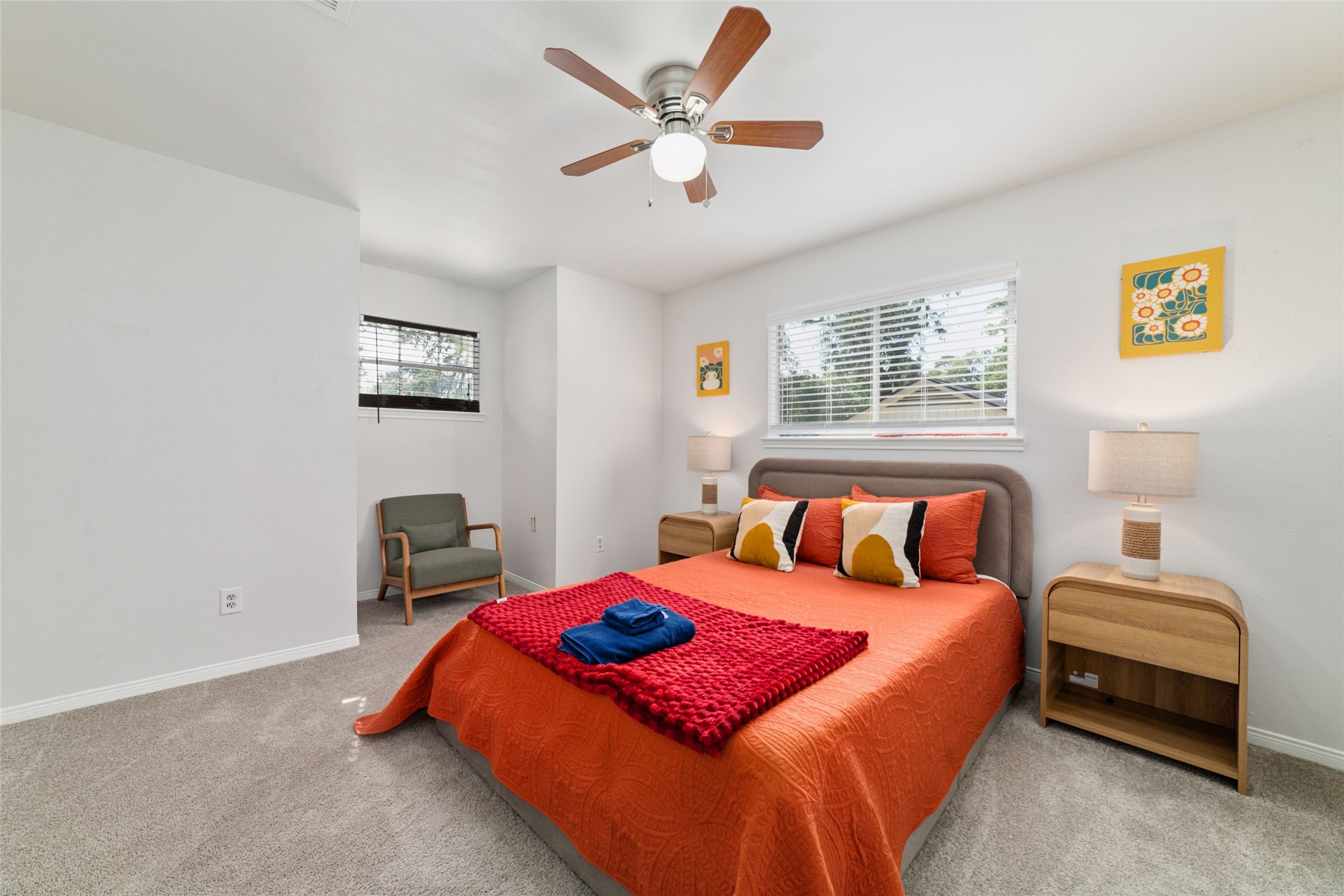 563 Landfall Lane Conroe, TX 77302 - Photo 20 of 25 a bedroom with a bed and a chandelier