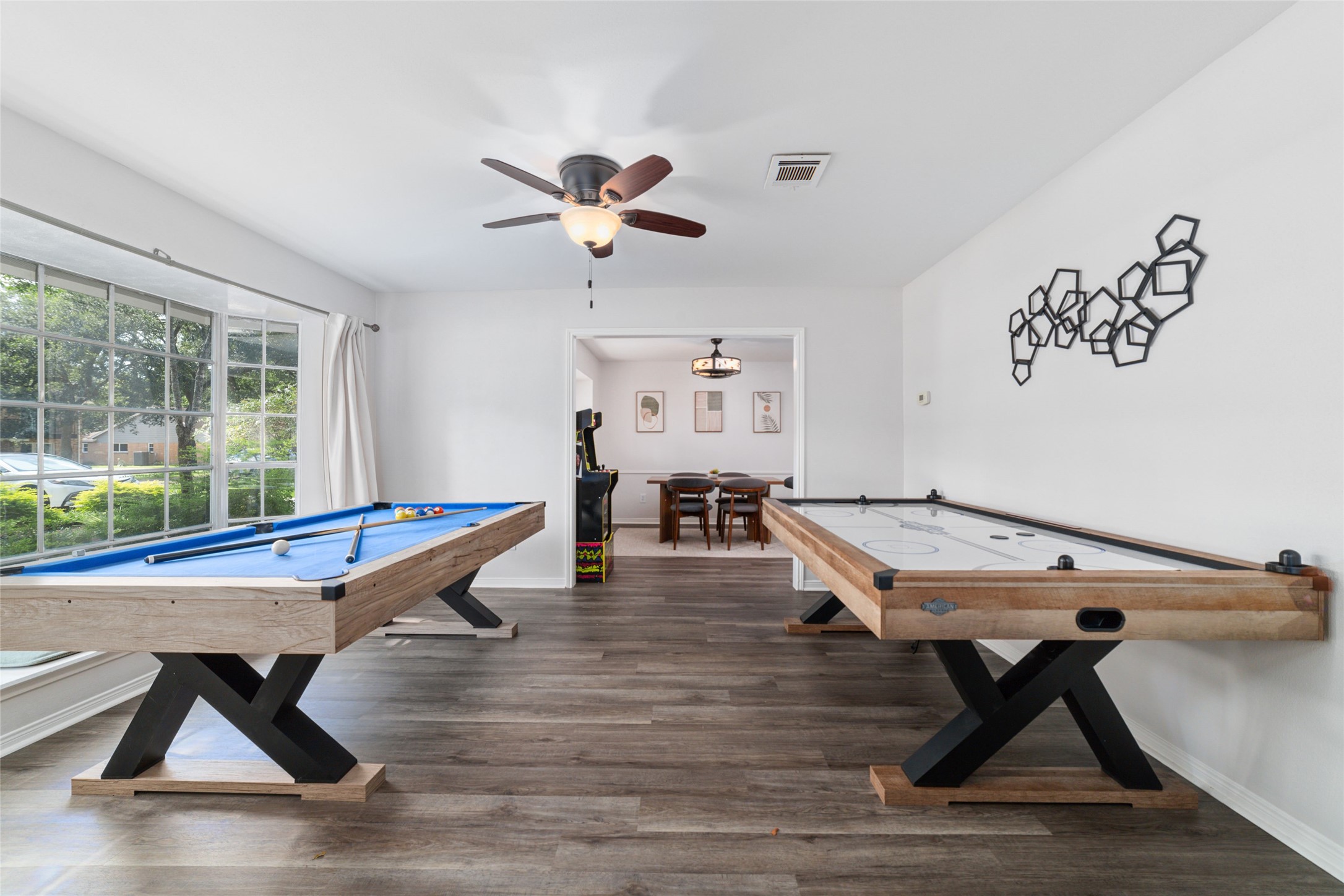563 Landfall Lane Conroe, TX 77302 - Photo 7 of 25 a living room with table chairs and a table