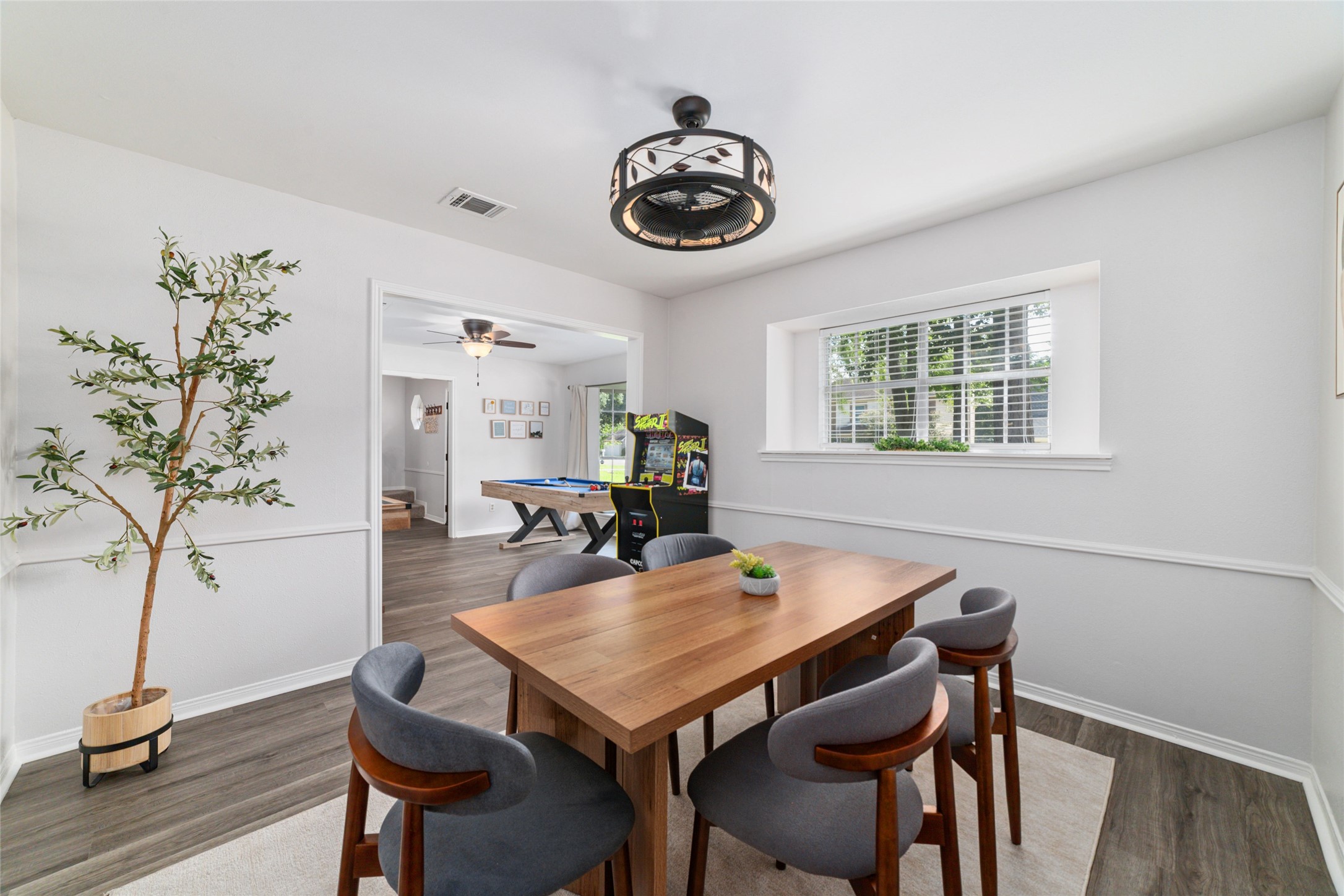 563 Landfall Lane Conroe, TX 77302 - Photo 9 of 25 a view of a dining room with furniture and wooden floor