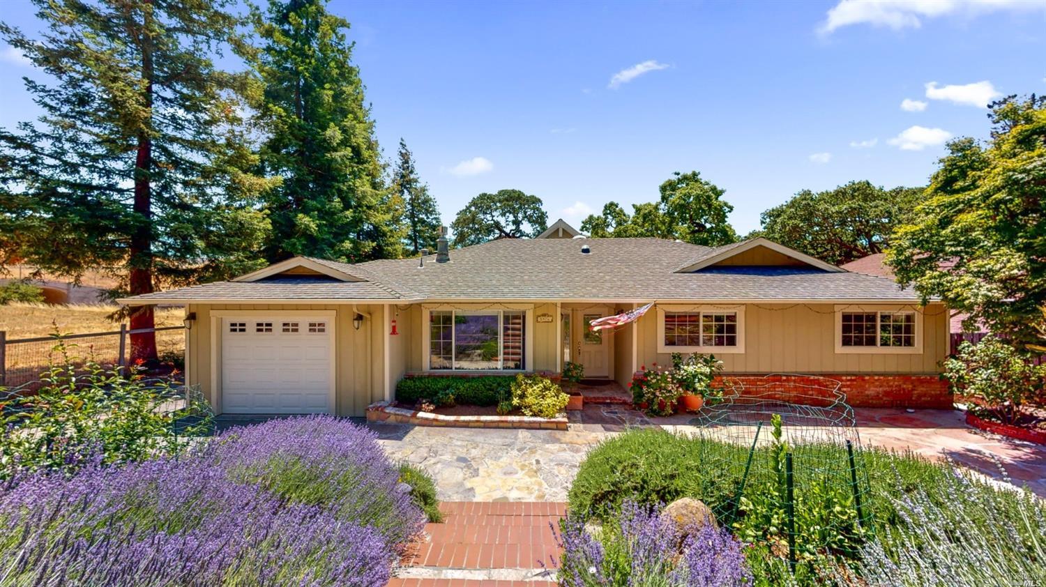 5976 Yerba Buena Road Santa Rosa, CA 95409 - Photo 1 of 1 a front view of house with yard and green space