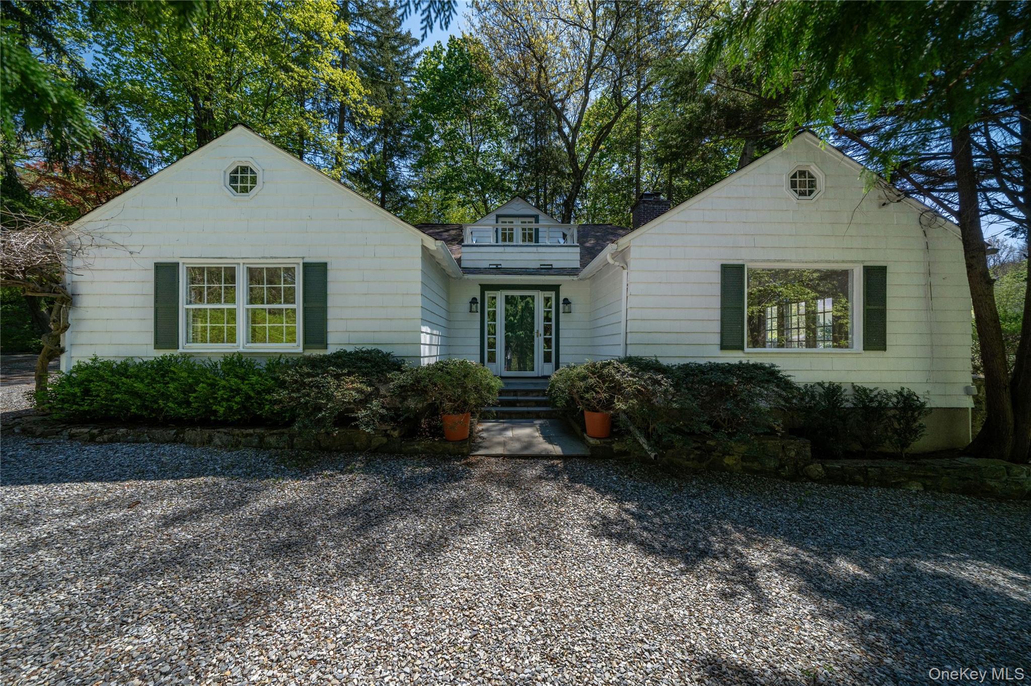105 Douglas Road Chappaqua, NY 10514 - Photo 1 of 18 a front view of a house with garden