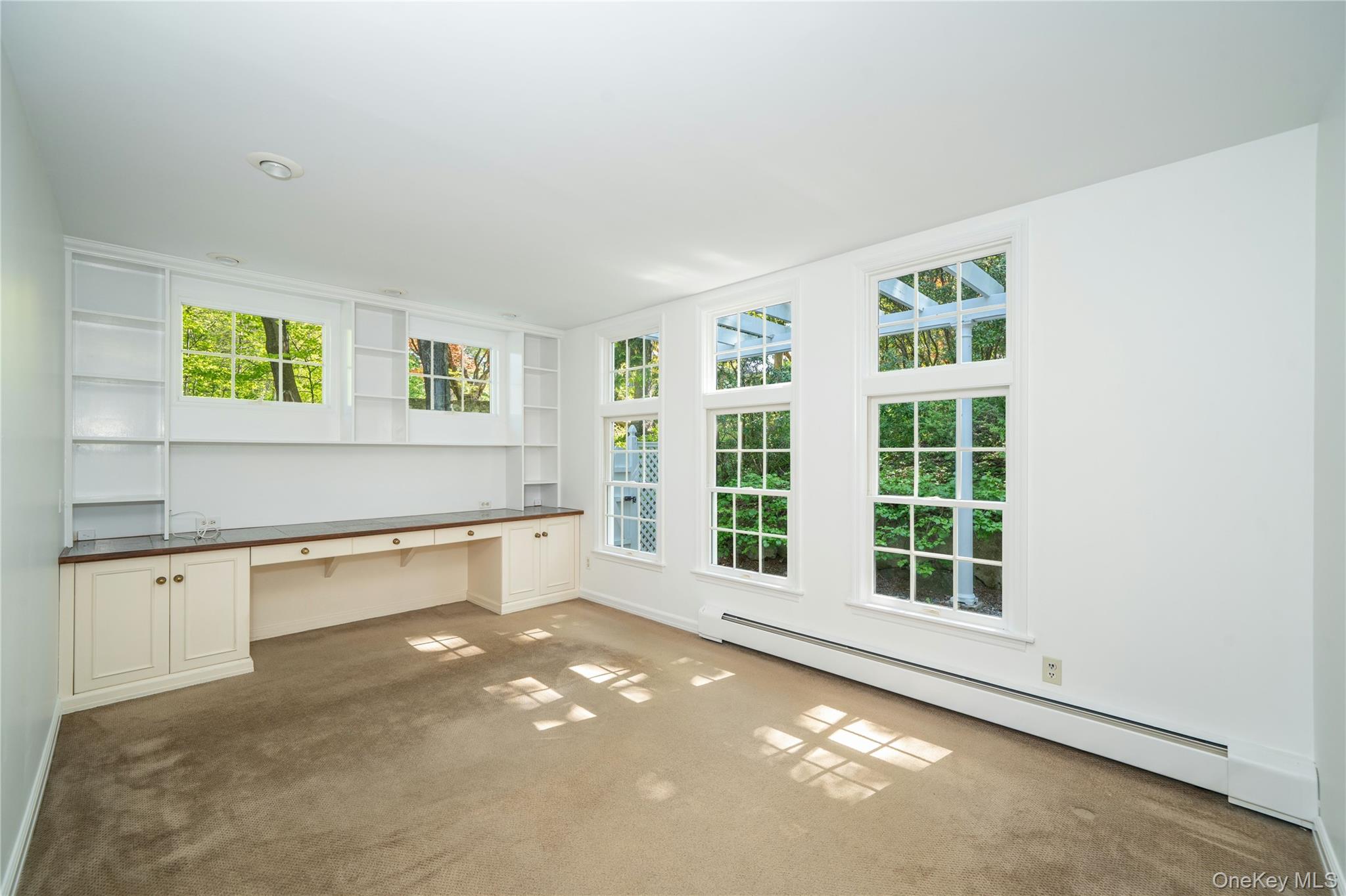 105 Douglas Road Chappaqua, NY 10514 - Photo 12 of 18 an empty room with windows
