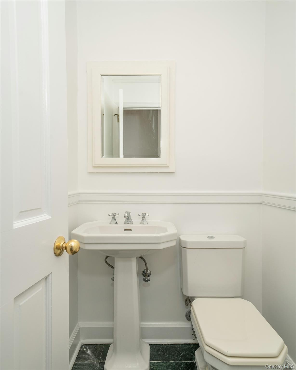 105 Douglas Road Chappaqua, NY 10514 - Photo 13 of 18 a bathroom with a toilet sink and mirror