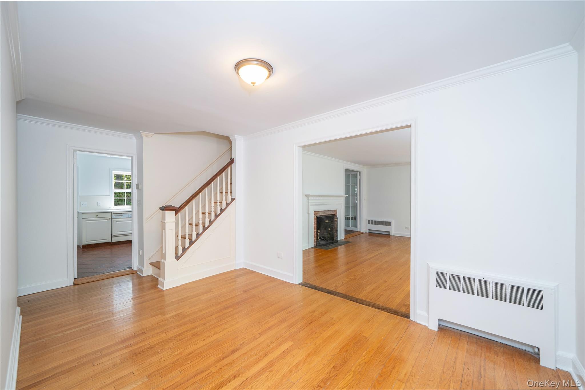 105 Douglas Road Chappaqua, NY 10514 - Photo 3 of 18 a view of empty room with wooden floor