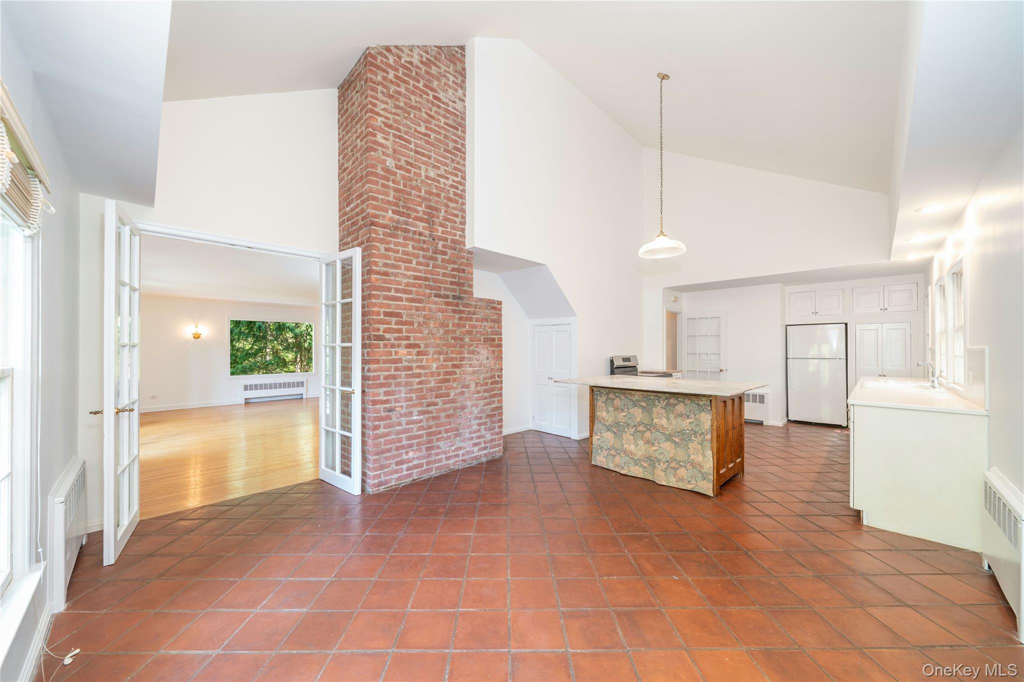 105 Douglas Road Chappaqua, NY 10514 - Photo 5 of 18 a view interior of a kitchen and an empty room