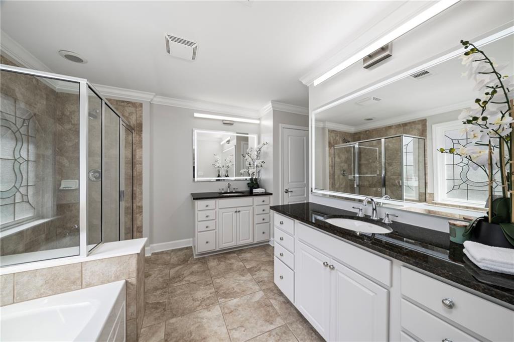2872 Overlook Way Northeast Atlanta, GA 30324 - Photo 21 of 47 a large bathroom with a granite countertop tub sink shower and mirror