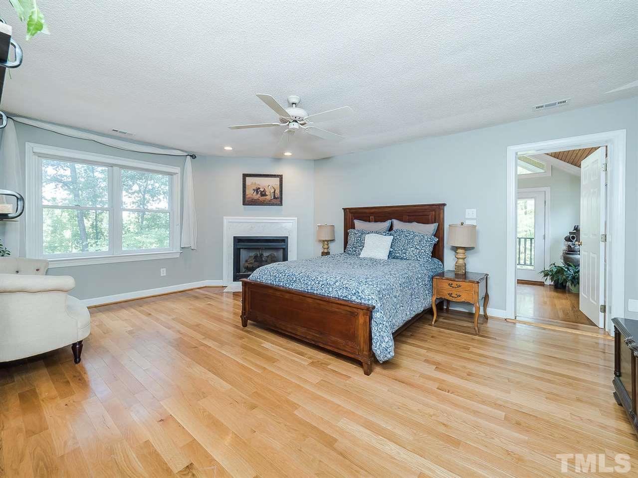 409 Luther Road Apex, NC 27523 - Photo 15 of 30 Includes private fireplace, two walk in closets and a sun-room with a balcony that oversees the property!
