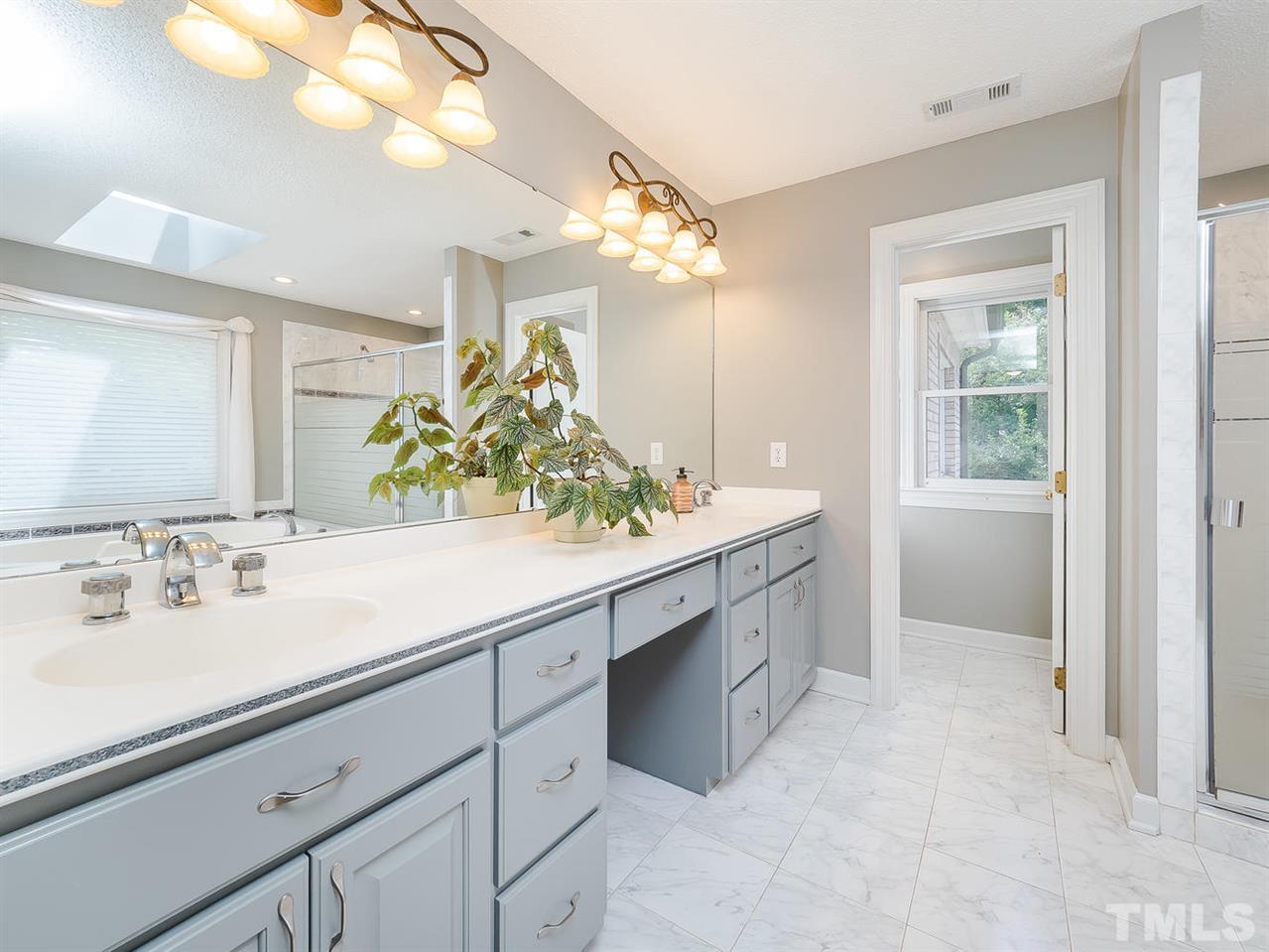 409 Luther Road Apex, NC 27523 - Photo 20 of 30 Dual sinks, plenty of counter space, freshly painted and a toilet room