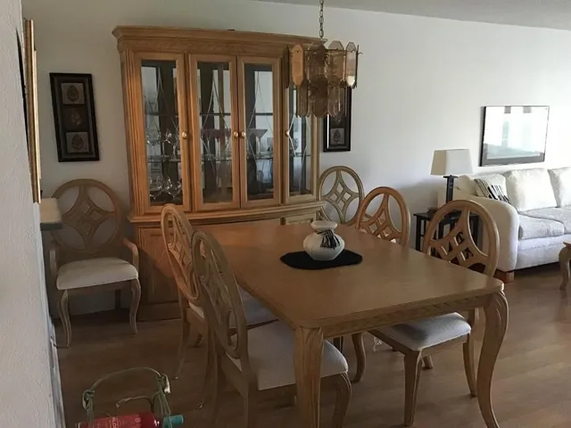 a dining room with furniture and window