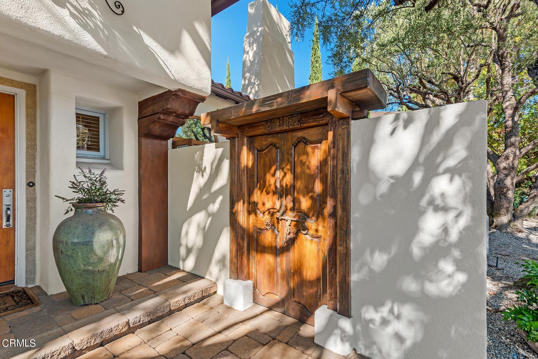 695 Holladay Road Pasadena, CA 91106 - Photo 16 of 44 a view of a house with a tree