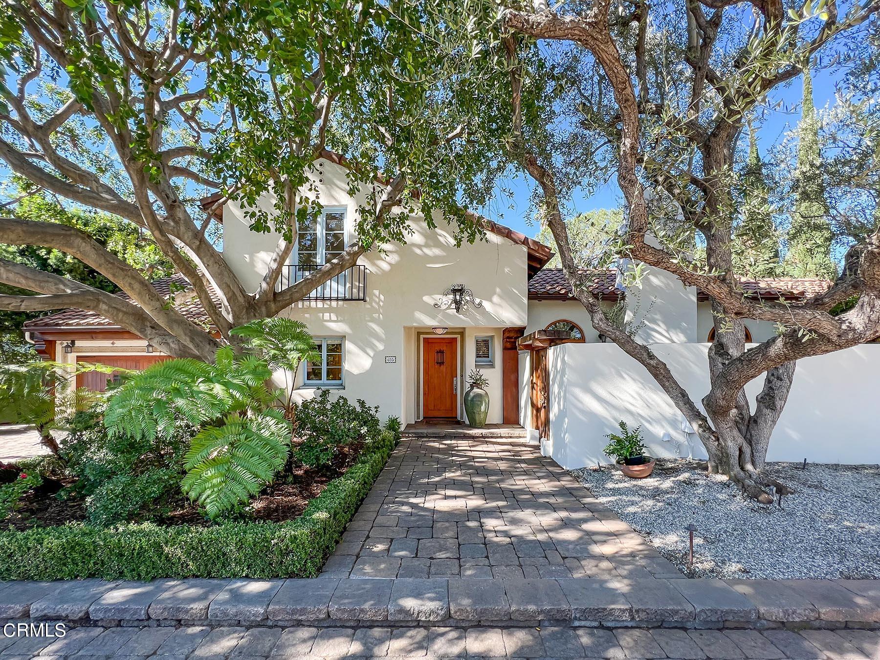 695 Holladay Road Pasadena, CA 91106 - Photo 2 of 44 a front view of a house with a yard and potted plants
