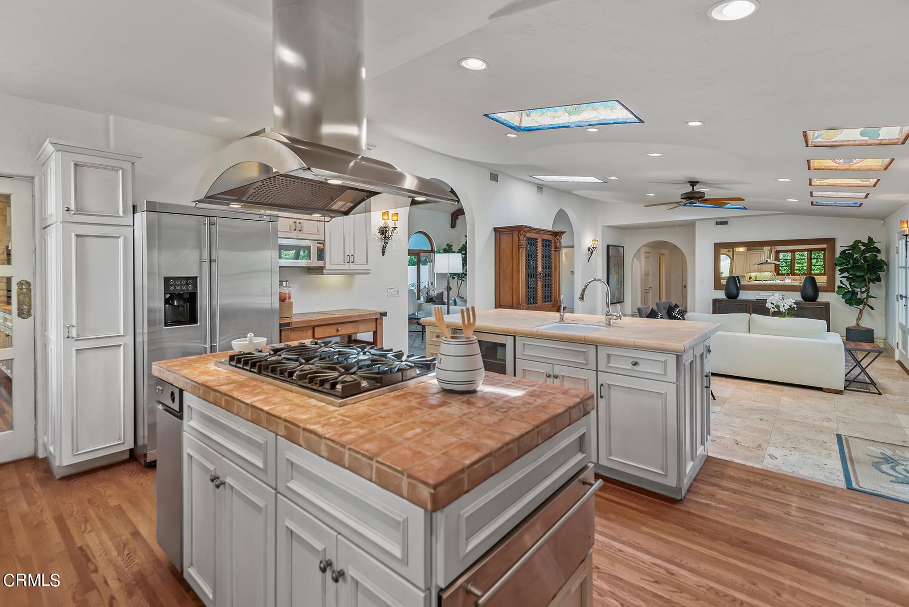 695 Holladay Road Pasadena, CA 91106 - Photo 23 of 44 a kitchen with a stove and a refrigerator