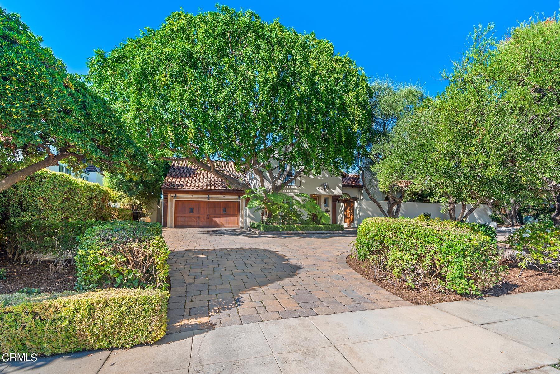 695 Holladay Road Pasadena, CA 91106 - Photo 3 of 44 a front view of a house with a yard and potted plants