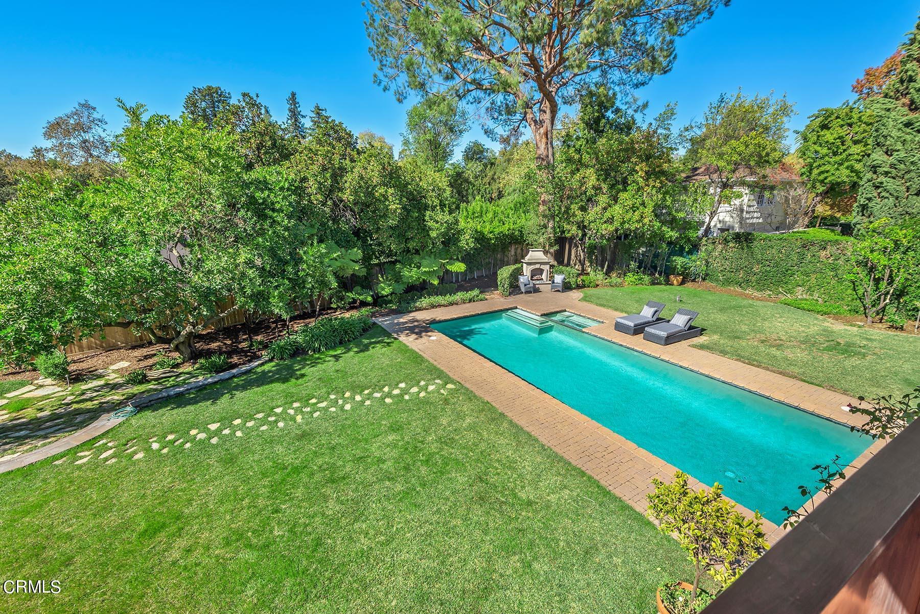 695 Holladay Road Pasadena, CA 91106 - Photo 33 of 44 a view of a golf course with a wooden fence