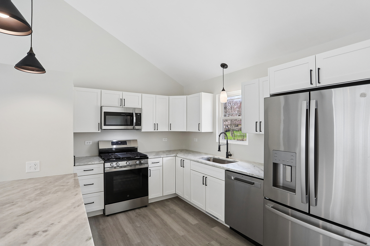 3520 William Street Steger, IL 60475 - Photo 4 of 21 a kitchen with stainless steel appliances a refrigerator sink and white cabinets