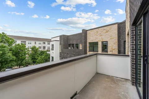 a view of balcony with yard
