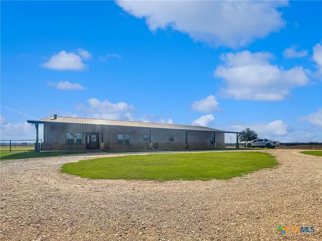 a view of a swimming pool with an outdoor space and seating area