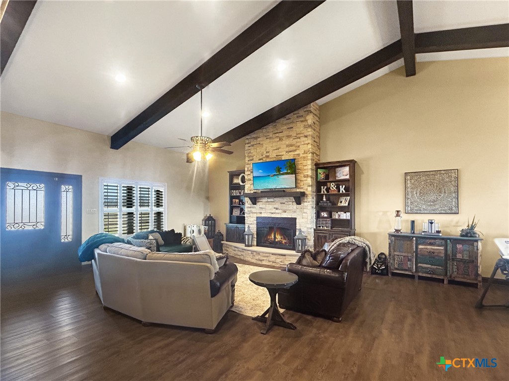 1747 Cr 139 Loop Cameron, TX 76520 - Photo 6 of 42 a living room with fireplace furniture and a wooden floor