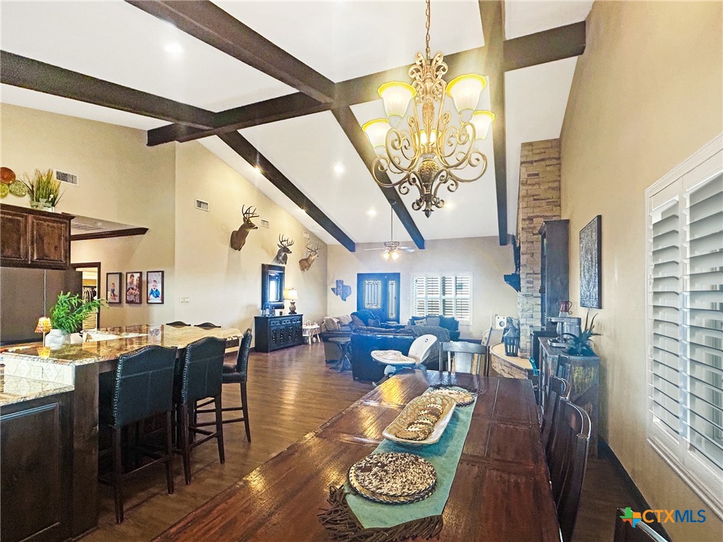 1747 Cr 139 Loop Cameron, TX 76520 - Photo 7 of 42 a living room with furniture and a chandelier