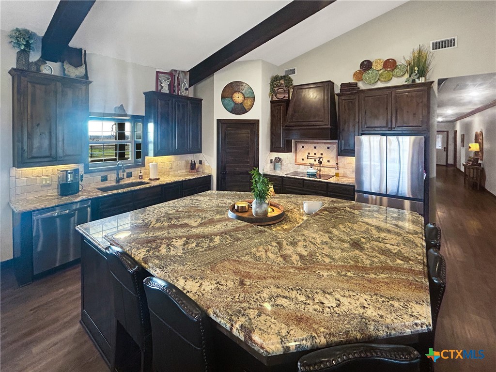 1747 Cr 139 Loop Cameron, TX 76520 - Photo 8 of 42 a view of a kitchen with a stove and cabinets