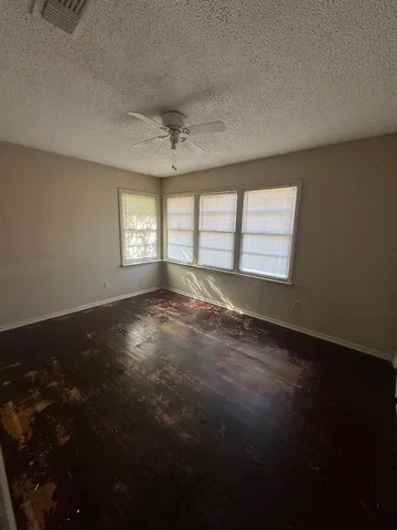 a view of empty room with windows