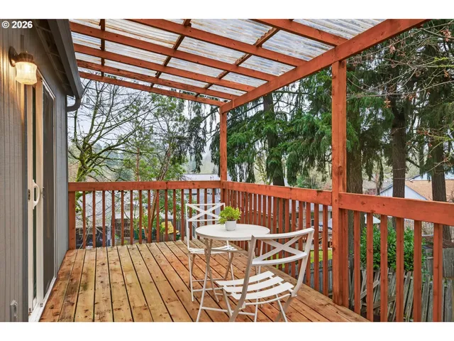 a view of a patio with wooden floor