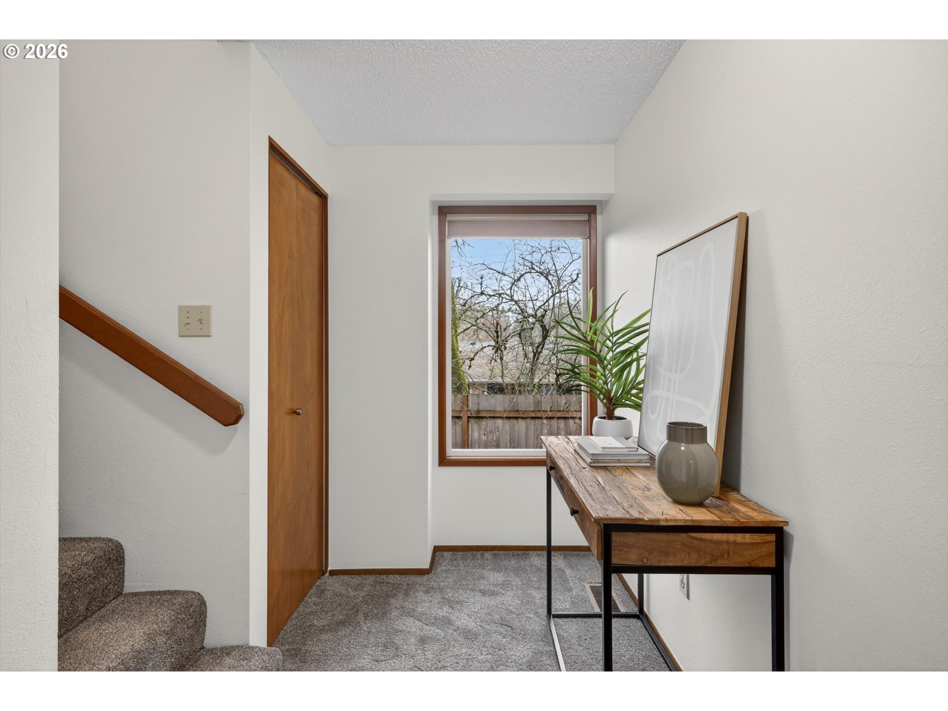 18145 Southwest Monte Verdi Boulevard Beaverton, OR 97007 - Photo 18 of 24 a living room with furniture and a window