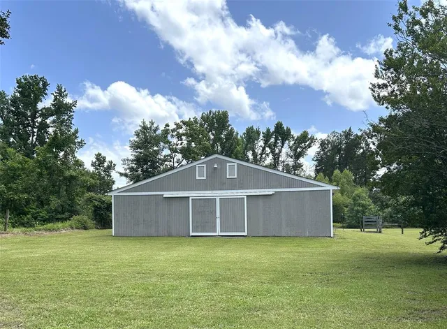 a house with trees in the background